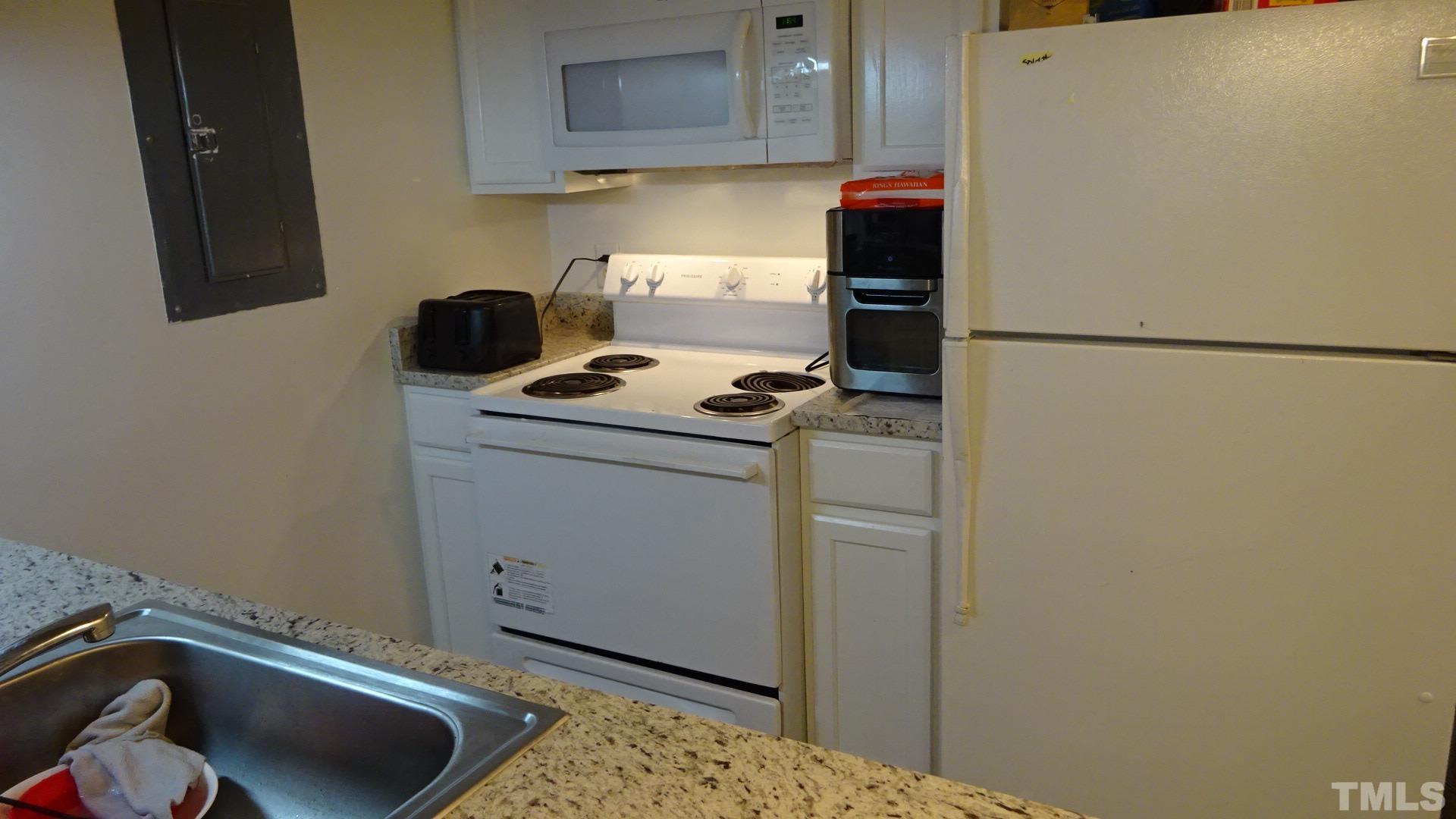 1441 Collegiate Circle, Unit 304 Raleigh, NC 27606 - Photo 9 of 24 a room with storage and utility