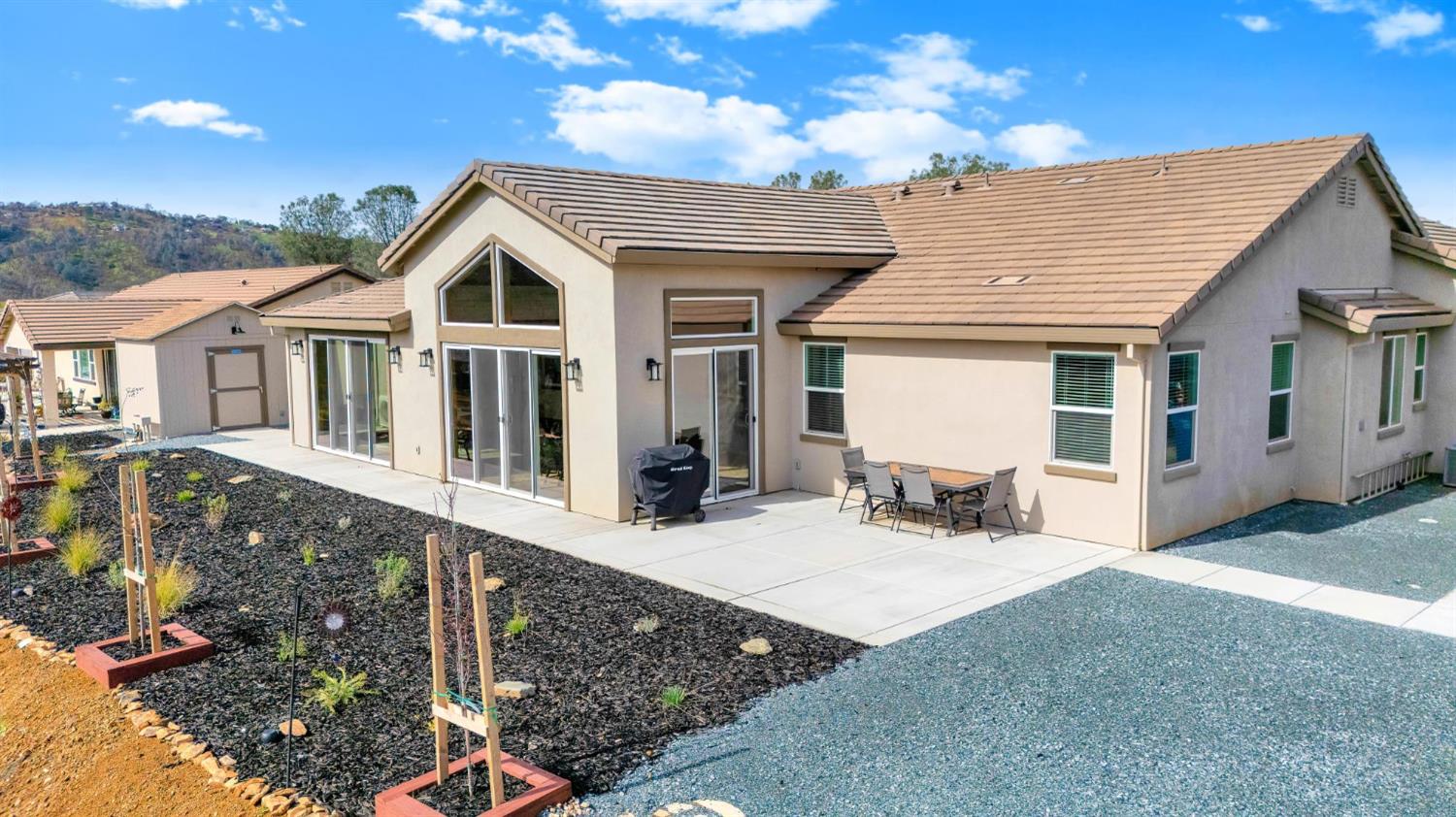133 Palisades Place Copperopolis, CA 95228 - Photo 38 of 95 a front view of a house with yard outdoor seating and barbeque oven
