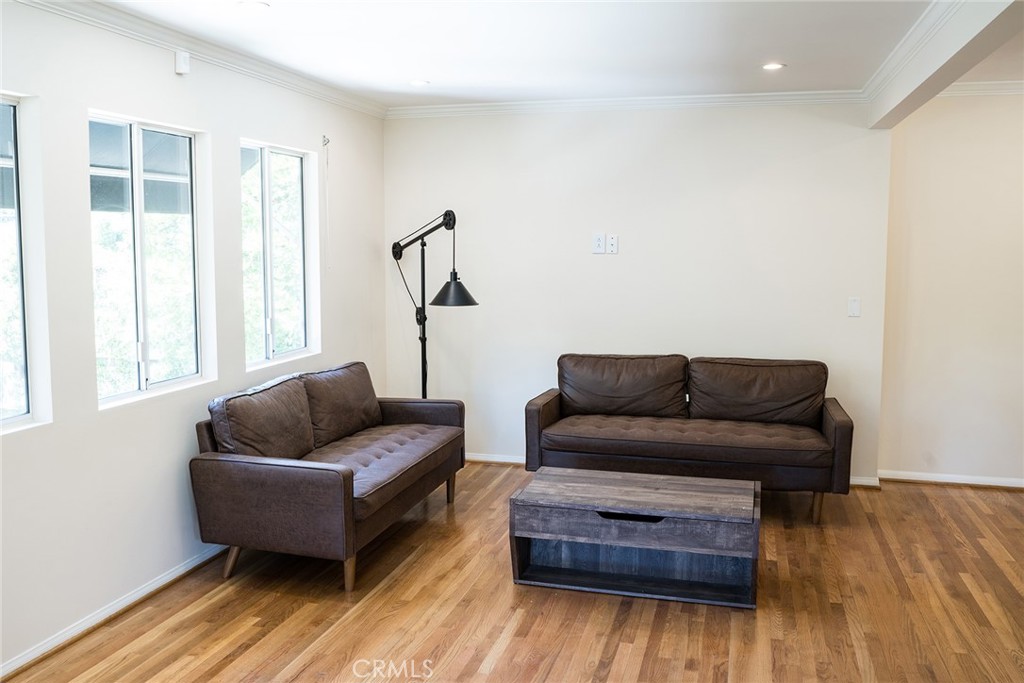 720 Heatherside Road Pasadena, CA 91105 - Photo 12 of 23 a living room with furniture and a wooden floor