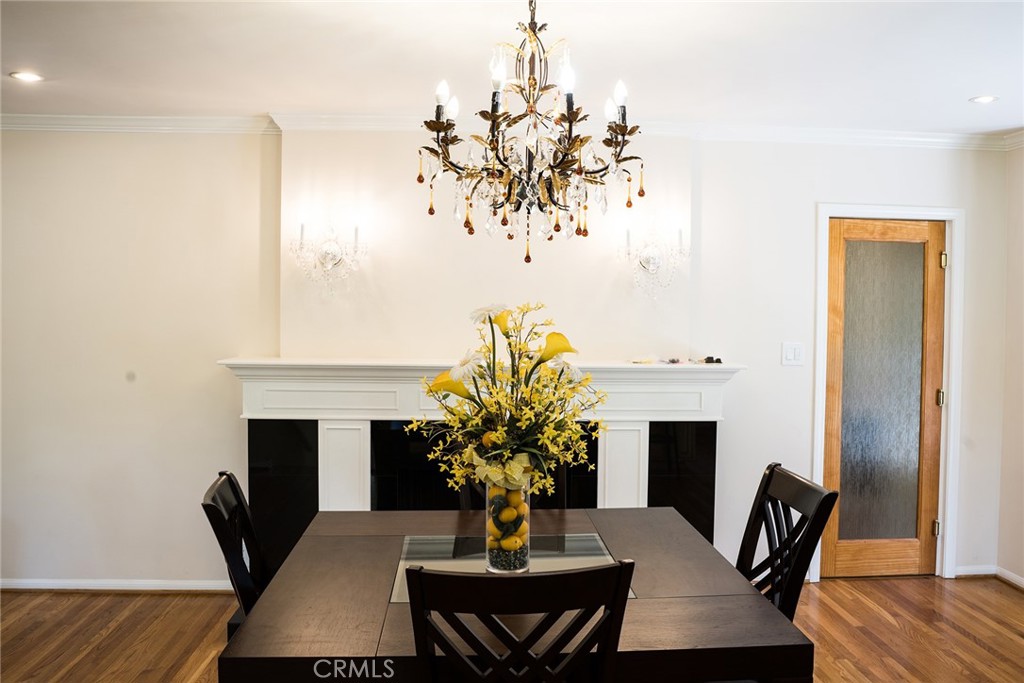 720 Heatherside Road Pasadena, CA 91105 - Photo 16 of 23 a view of a dining room with furniture and wooden floor