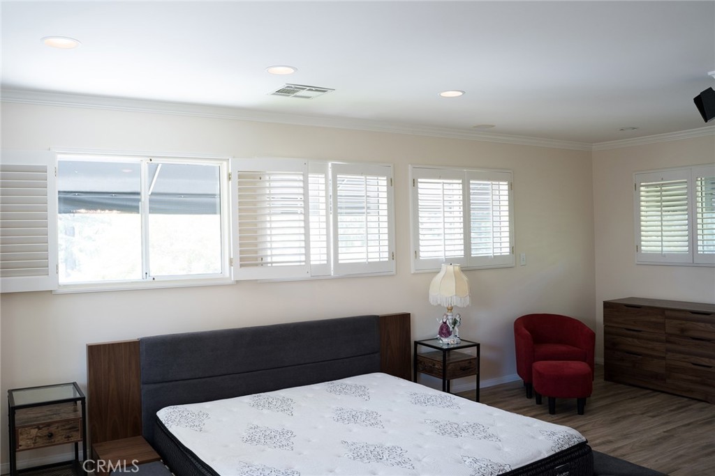 720 Heatherside Road Pasadena, CA 91105 - Photo 7 of 23 a bedroom with a bed and window