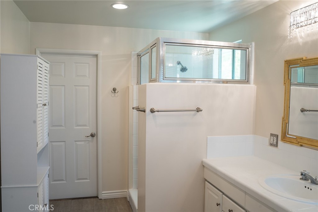 720 Heatherside Road Pasadena, CA 91105 - Photo 9 of 23 a bathroom with a sink and mirror