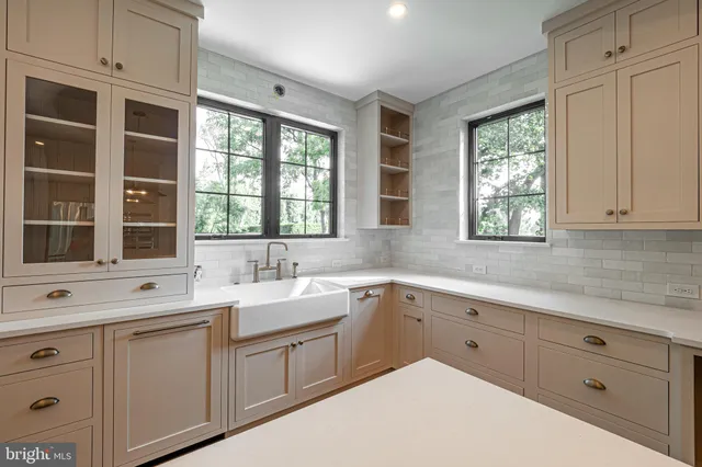 a kitchen with sink cabinets and window