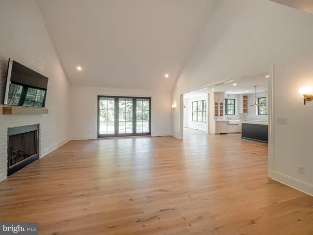 a view of a livingroom with furniture a fireplace
