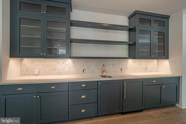 a kitchen with a sink and cabinets