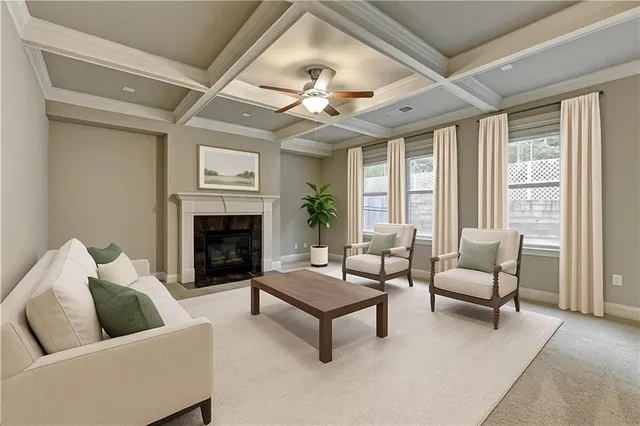 a view of an empty room with a fireplace and a window