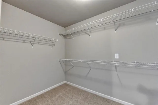 a view of room with chandelier fan