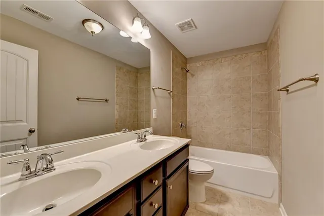 an aerial view of residential house with outdoor space and swimming pool