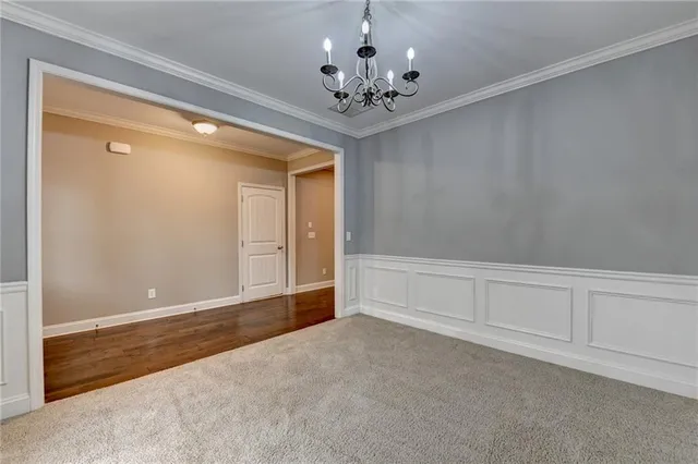 a kitchen with kitchen island granite countertop wooden floors stainless steel appliances and sink