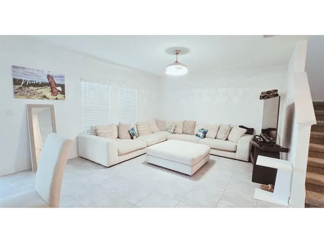 a living room with furniture and a couch