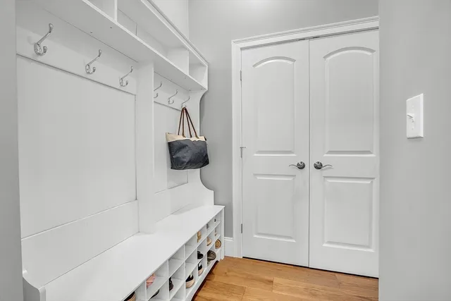 a view of a hallway with windows and stairs
