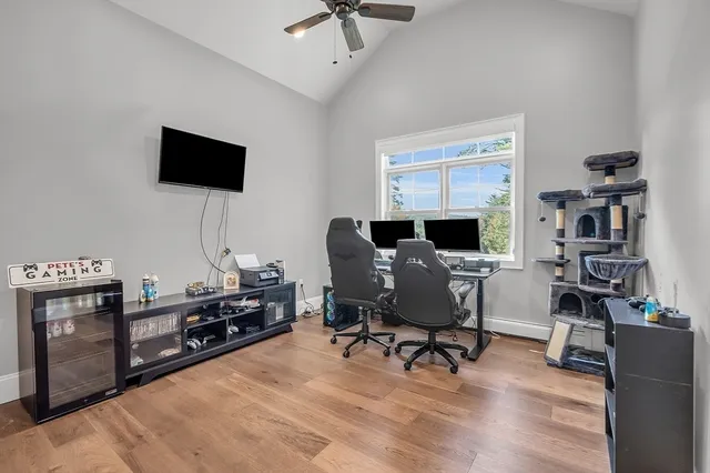 a bathroom with a granite countertop sink toilet and mirror