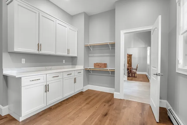 a utility room with sink dryer and washer