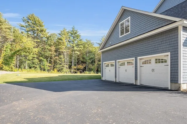 a view of a yard with chairs