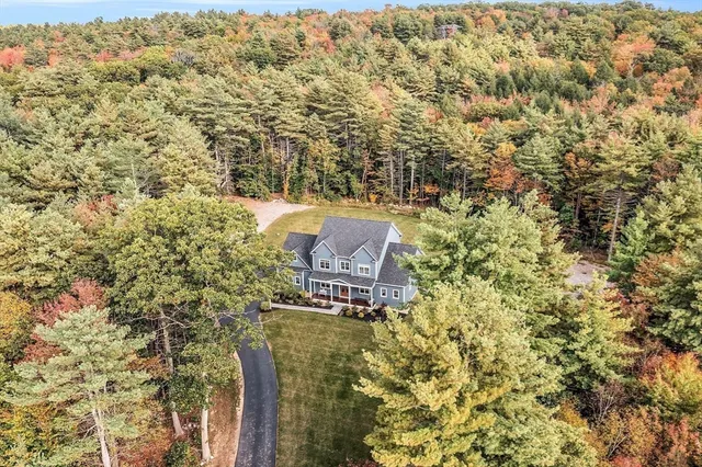 an aerial view of residential houses with outdoor space