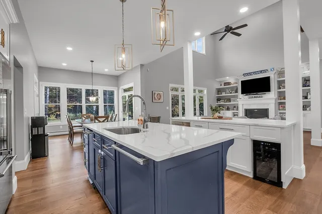 a kitchen with sink stove and refrigerator