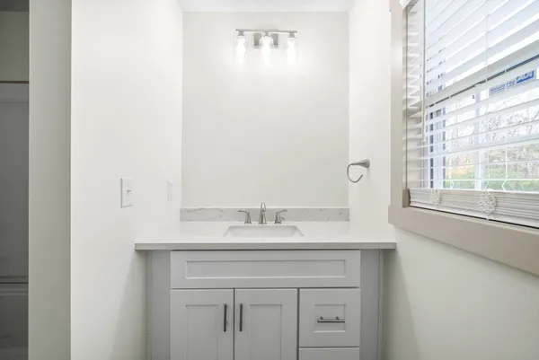 a sink with a mirror