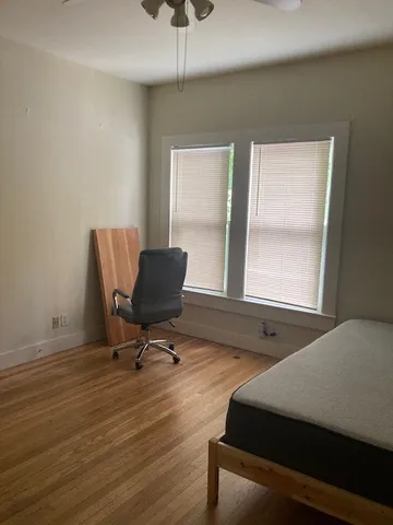 a room with chair and windows