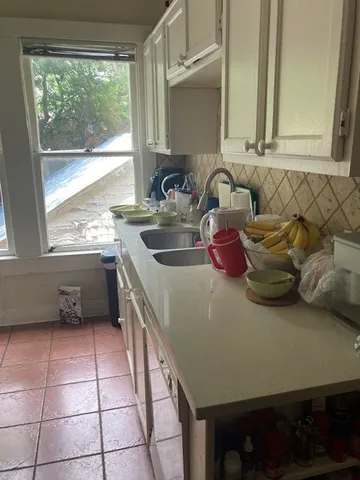 a kitchen with a sink and a stove