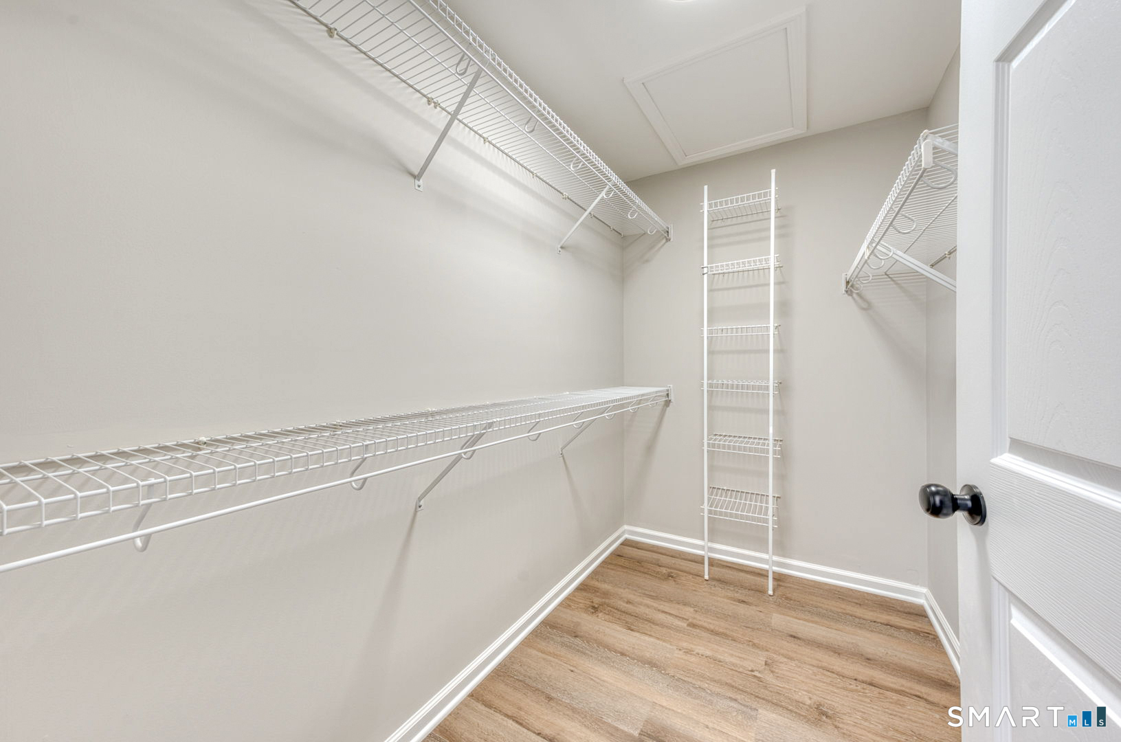 159 Jennifer Lane, Unit 159 Newtown, CT 06482 - Photo 20 of 28 a view of walk in closet with empty racks