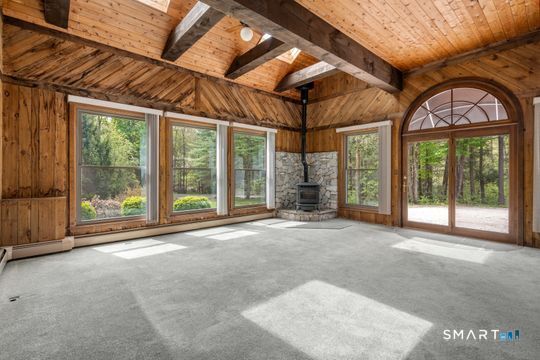 26 Old Coach Road Barkhamsted, CT 06063 - Photo 15 of 35 a view of a room with large windows and balcony