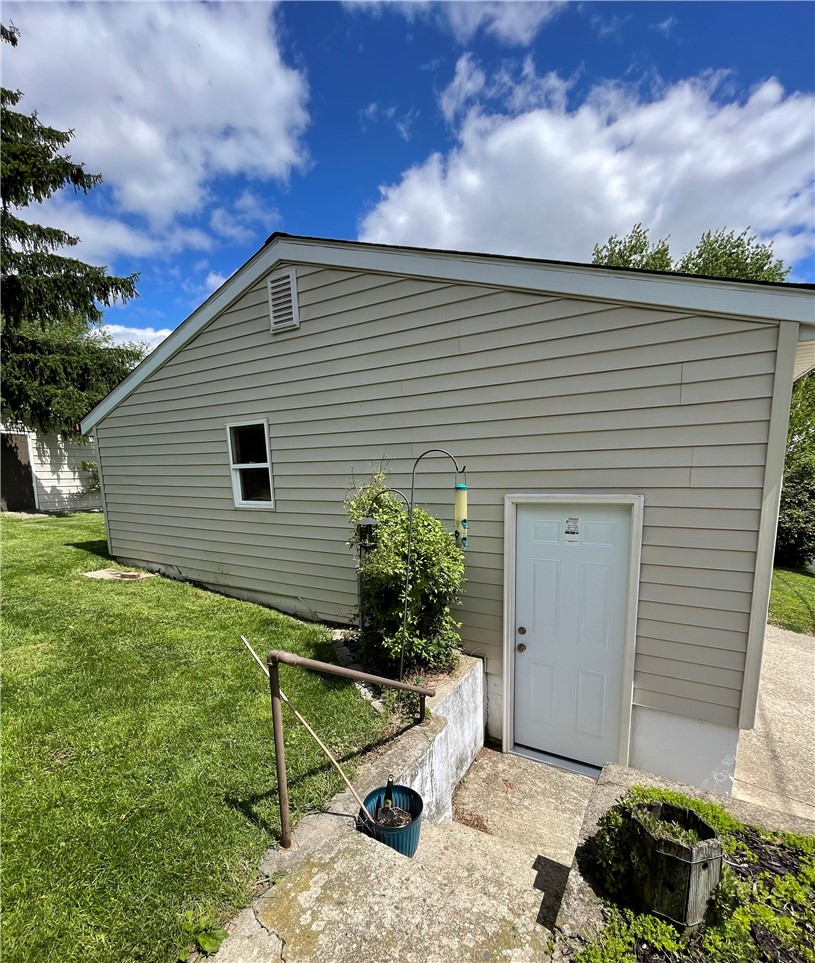 360 Ridge Street Piqua, OH 45356 - Photo 35 of 46 This charming home offers convenient exterior access to the lower level, perfect for storage or expansion.