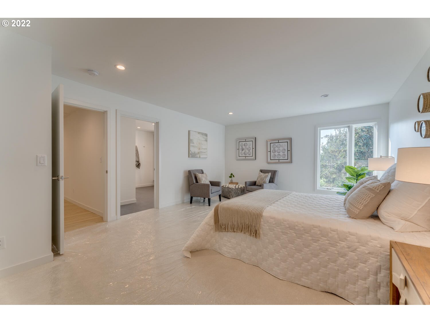 10424 Northwest Laidlaw Road Portland, OR 97229 - Photo 12 of 32 a bedroom with a bed and a couch
