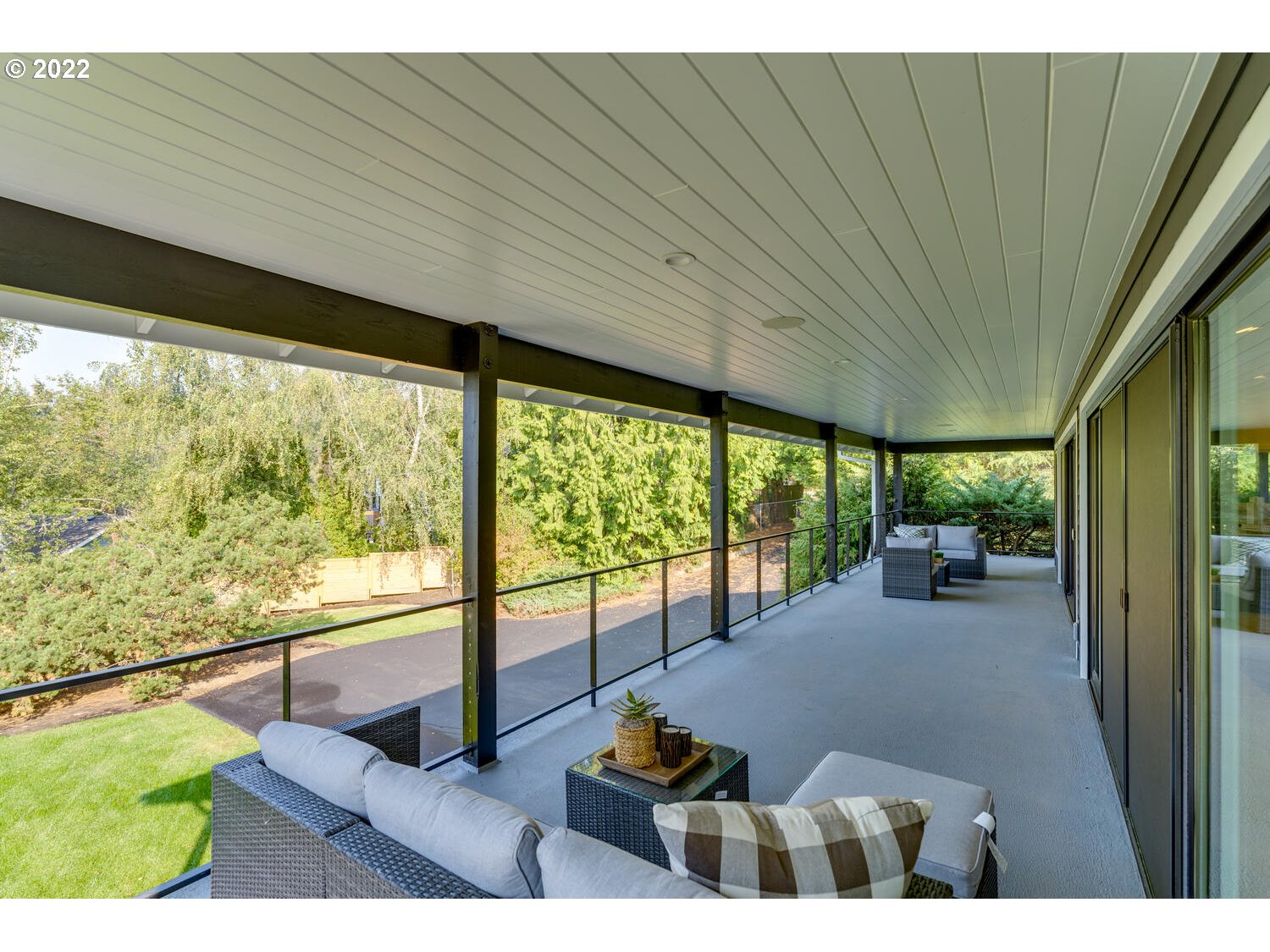 10424 Northwest Laidlaw Road Portland, OR 97229 - Photo 16 of 32 a living room with furniture tv and a large window