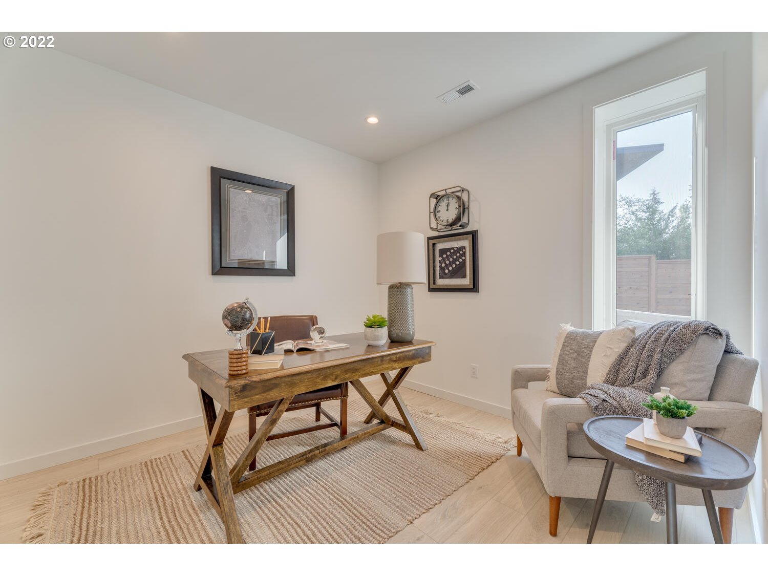 10424 Northwest Laidlaw Road Portland, OR 97229 - Photo 21 of 32 a living room with furniture and a window