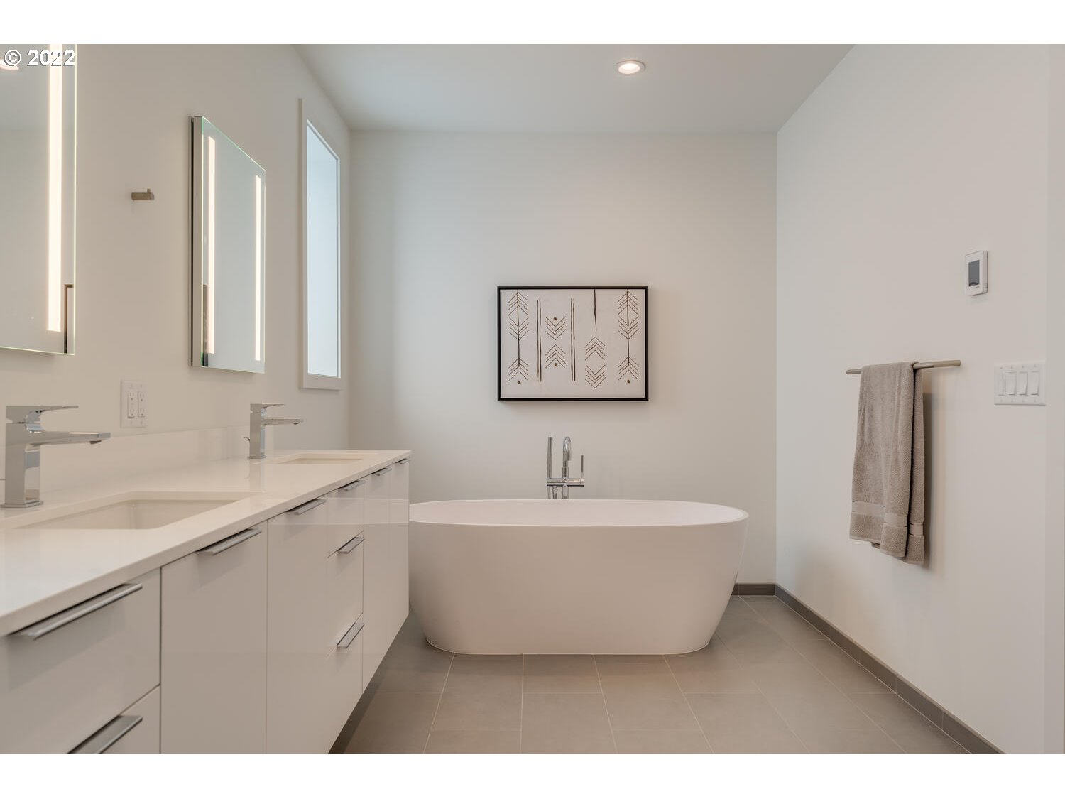 10424 Northwest Laidlaw Road Portland, OR 97229 - Photo 26 of 32 a spacious bathroom with a double vanity sink mirror and bathtub