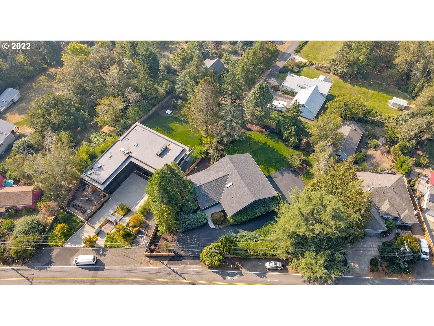 10424 Northwest Laidlaw Road Portland, OR 97229 - Photo 29 of 32 an aerial view of a house with a yard and garden