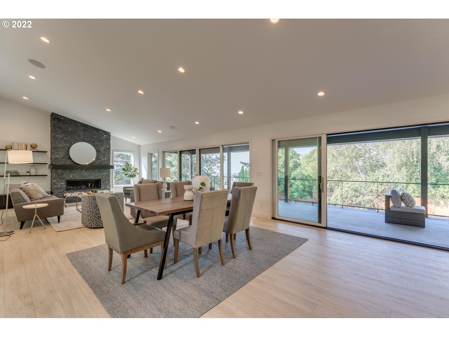 10424 Northwest Laidlaw Road Portland, OR 97229 - Photo 7 of 32 a view of a dining room with furniture window and wooden floor