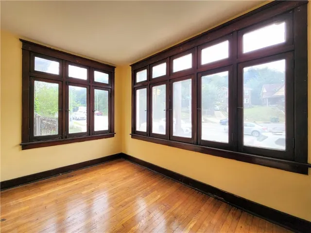a view of an empty room with a large window