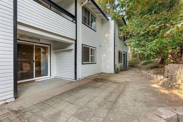 a view of a house with a yard and garage