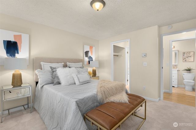 a bedroom with a bed and walk in closet