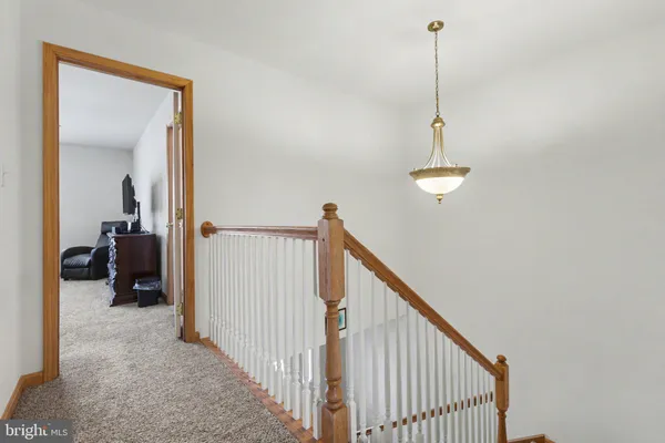 a view of a hallway view with staircase