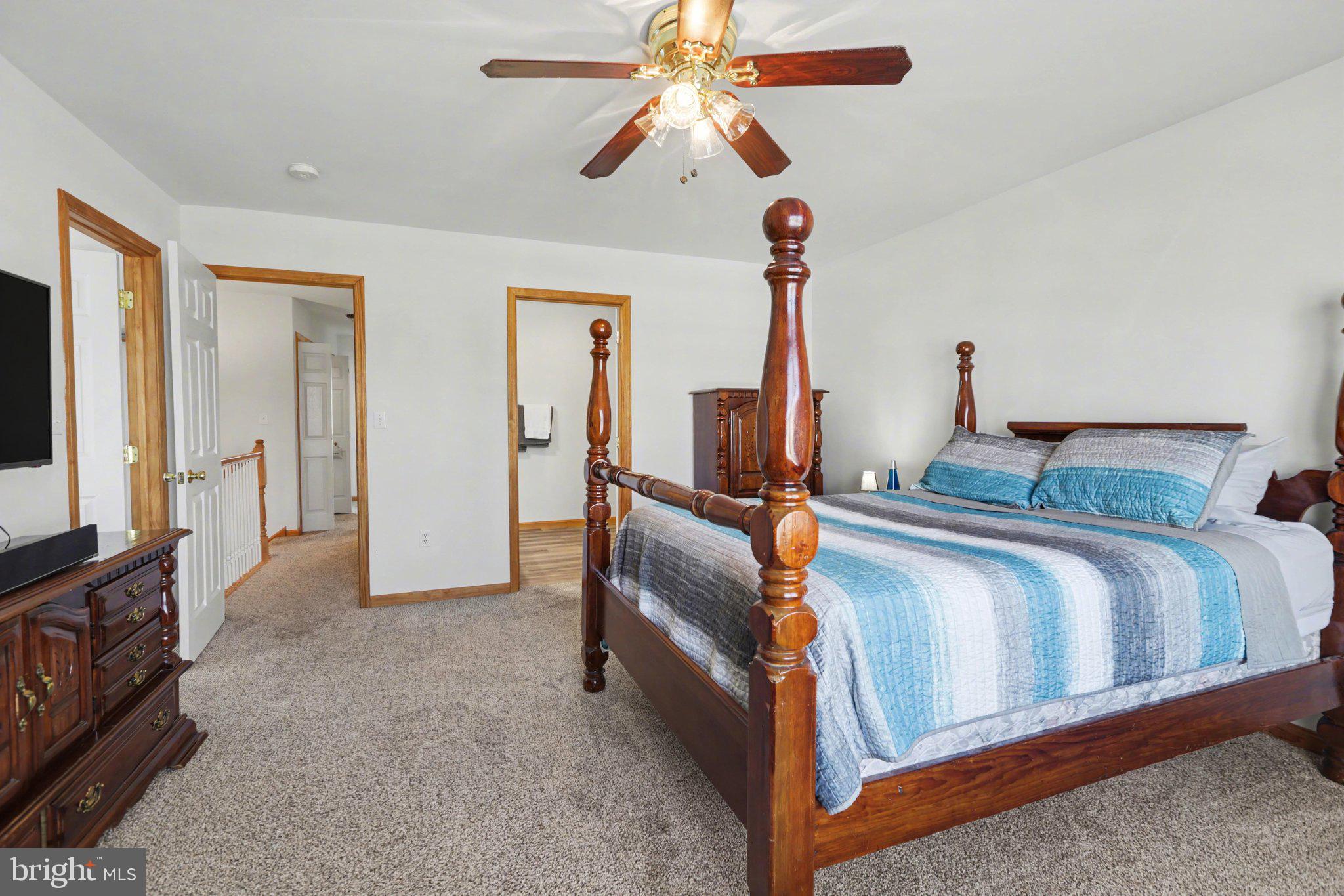 134 Sable Drive Carlisle, PA 17013 - Photo 15 of 37 a bedroom with bed and a chandelier