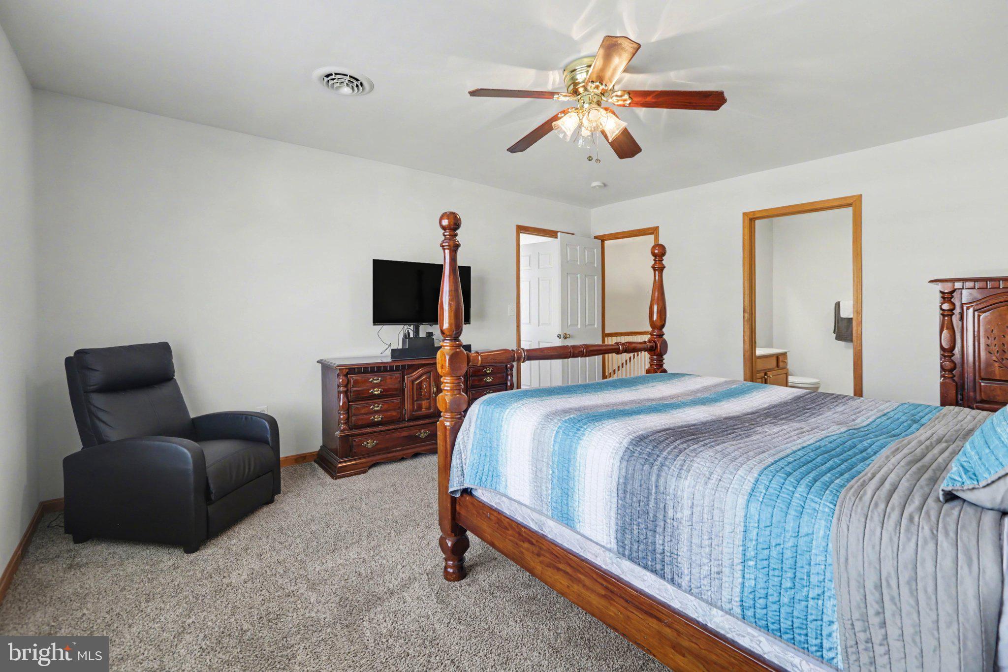 134 Sable Drive Carlisle, PA 17013 - Photo 16 of 37 a bedroom with a bed couch and a window