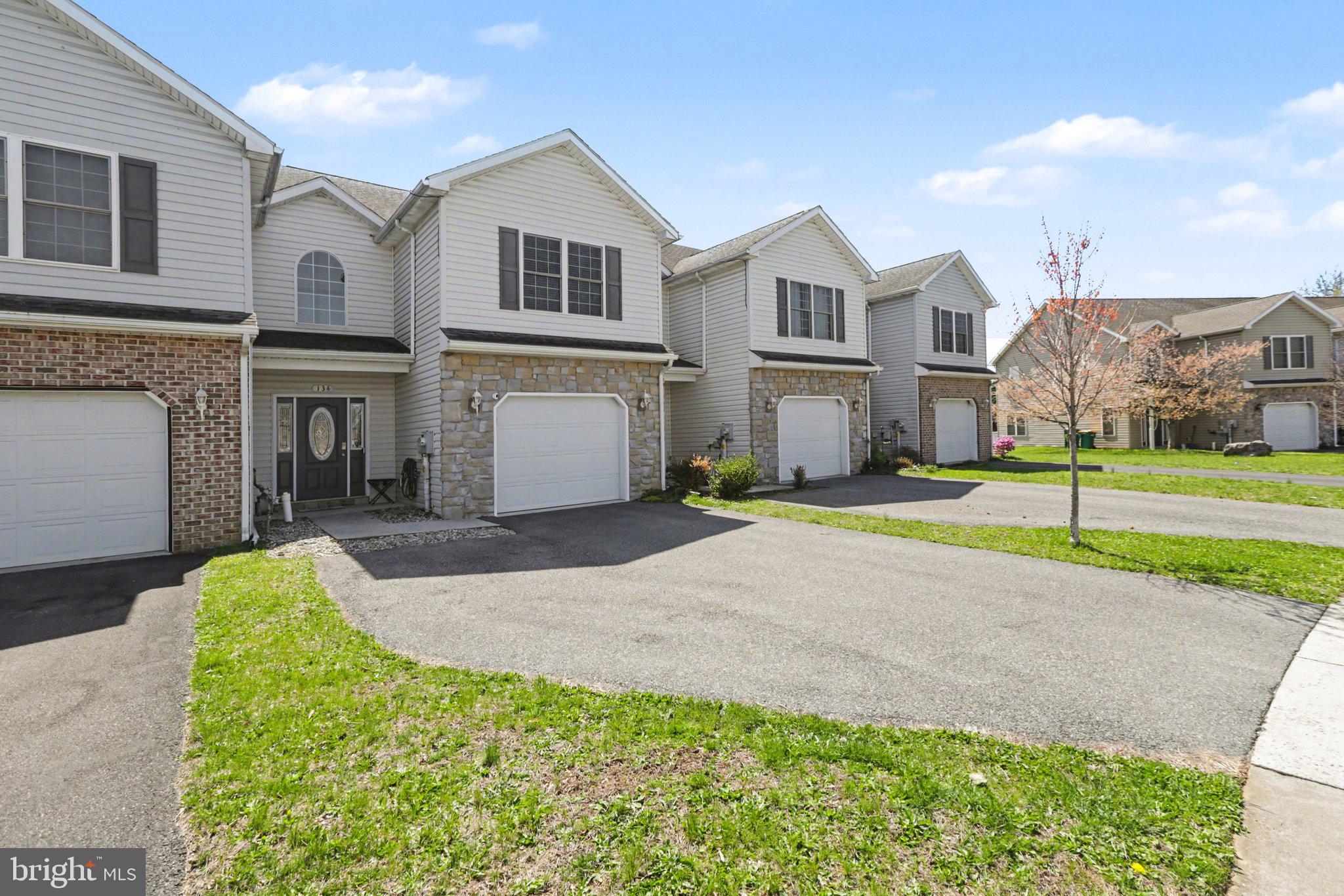 134 Sable Drive Carlisle, PA 17013 - Photo 28 of 37 a front view of a house with a yard and garage