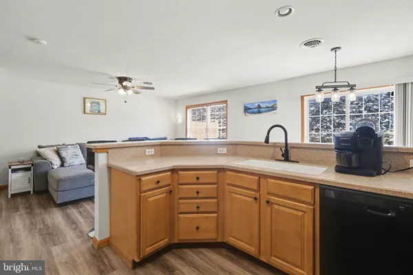 a kitchen with a sink and cabinets