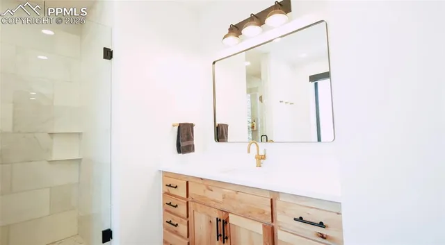 a bathroom with a sink and a mirror