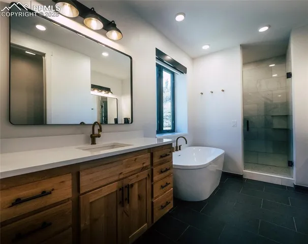 a bathroom with a double vanity sink and a mirror