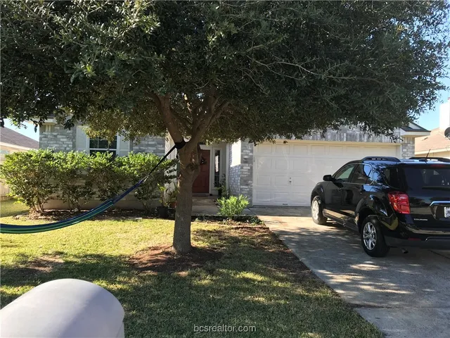 a view of a car in front of house