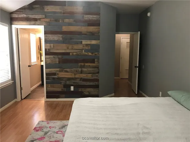 a view of walk in closet with empty room