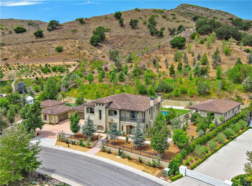 an aerial view of a house with a garden