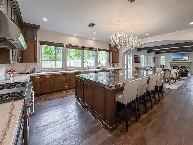 a large kitchen with lots of counter space a sink and appliances