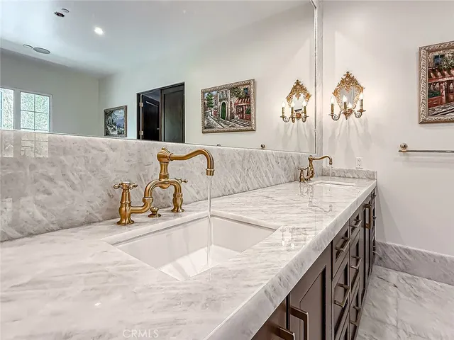 a kitchen with a sink and a refrigerator