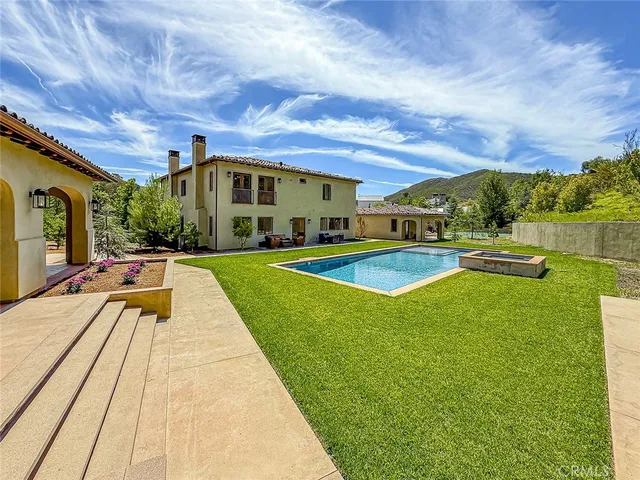 a kitchen with stainless steel appliances a stove top oven and sink