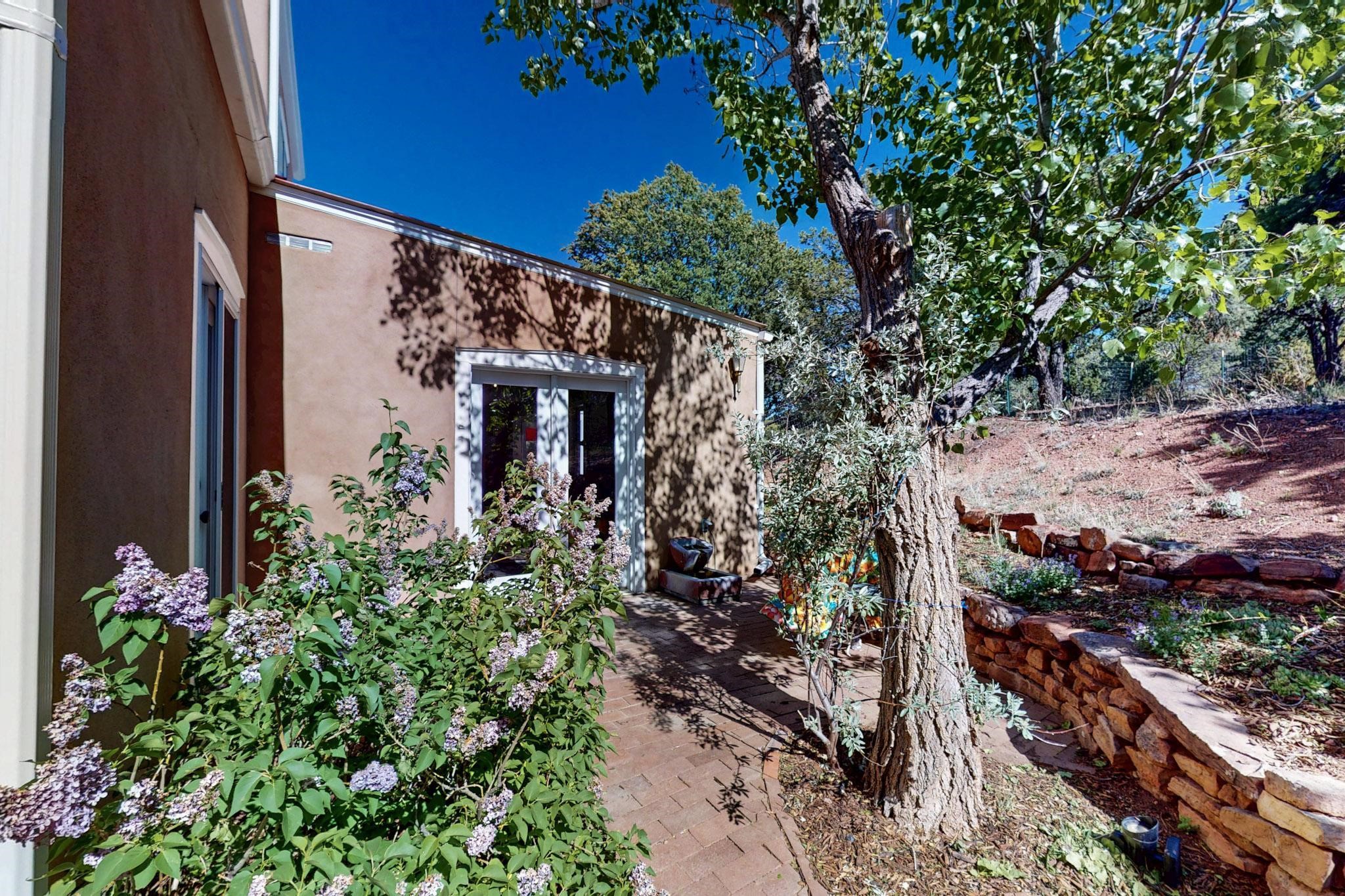 15 Toltec Road Santa Fe, NM 87505 - Photo 39 of 72 Living room French doors out to the back/side patio
