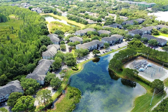 an aerial view of a house with a yard